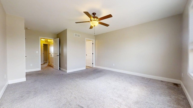 750 Sedgegrass Dr, Champaign, IL 61822 - unfurnished bedroom with light carpet, baseboards, and ceiling fan