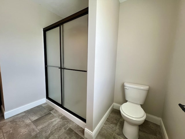 750 Sedgegrass Dr, Champaign, IL 61822 - bathroom with toilet, a shower stall, and baseboards