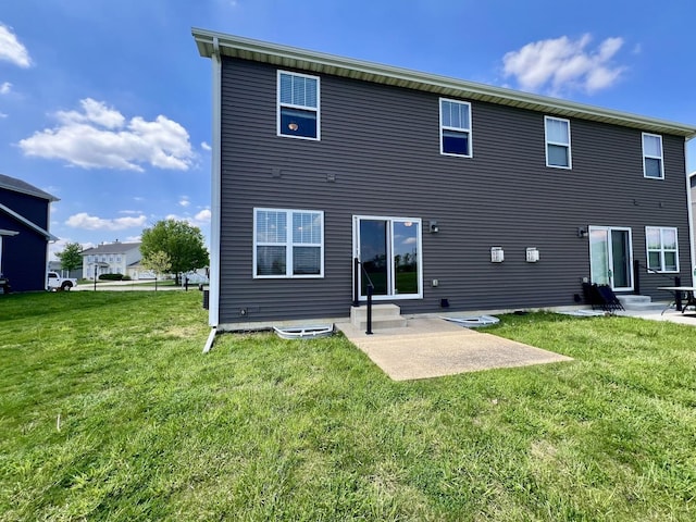 750 Sedgegrass Dr, Champaign, IL 61822 - rear view of house featuring entry steps, a patio, and a lawn