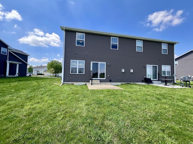 750 Sedgegrass Dr, Champaign, IL 61822 - back of property featuring a patio, a lawn, and entry steps