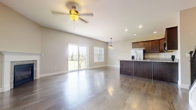 750 Sedgegrass Dr, Champaign, IL 61822 - kitchen featuring fridge with ice dispenser, open floor plan, ceiling fan, recessed lighting, and dark brown cabinetry