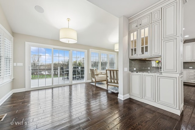 6 Shenandoah Cir S, Barrington, IL 60010 - unfurnished dining area featuring baseboards and dark wood-style flooring