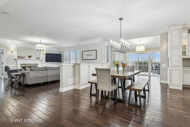 6 Shenandoah Cir S, Barrington, IL 60010 - dining room with dark wood finished floors, visible vents, a notable chandelier, and a stone fireplace