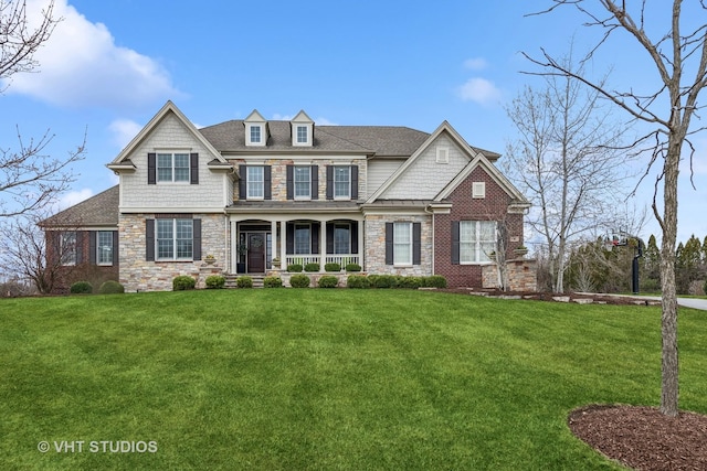 6 Shenandoah Cir S, Barrington, IL 60010 - craftsman-style home with a porch, a shingled roof, a front lawn, and stone siding