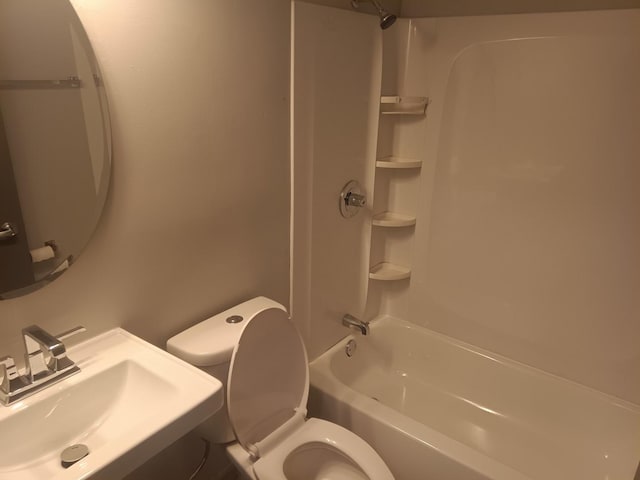 full bathroom featuring a sink, toilet, and bathtub / shower combination
