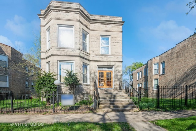 7206 S Champlain Ave, Chicago, IL 60619 - view of front of property with french doors, stone siding, and stairs