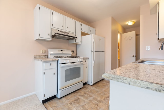 kitchen with white cabinets, a sink, white appliances, light countertops, and under cabinet range hood