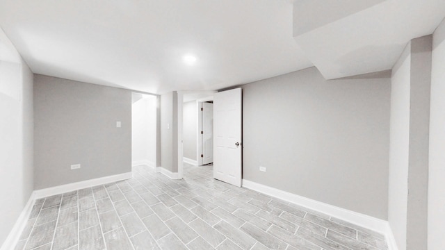 unfurnished room featuring baseboards