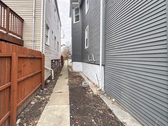 view of property exterior featuring fence