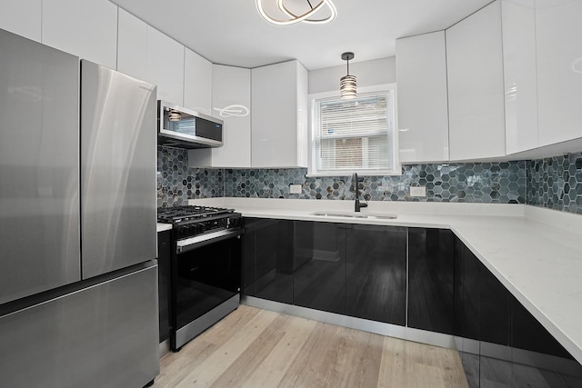 1158 W 111th St, Chicago, IL 60643 - kitchen featuring modern cabinets, white cabinetry, a sink, stainless steel appliances, and decorative backsplash