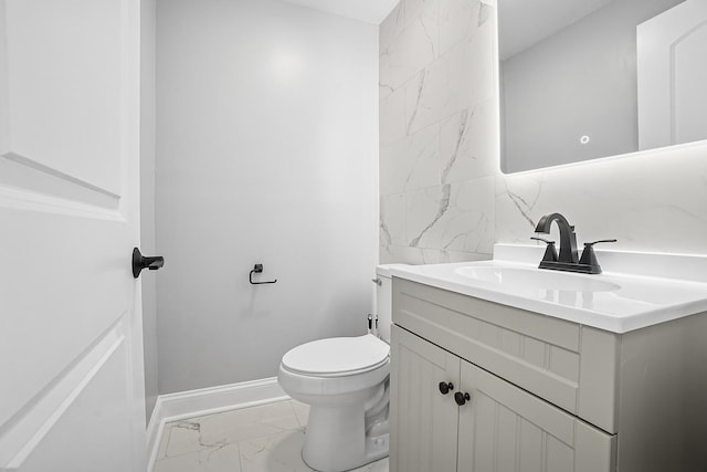 1158 W 111th St, Chicago, IL 60643 - bathroom featuring vanity, toilet, marble finish floor, tile walls, and baseboards