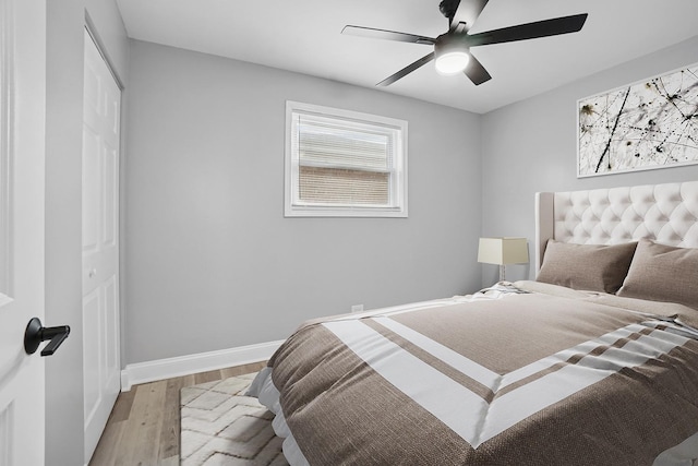 1158 W 111th St, Chicago, IL 60643 - bedroom featuring a closet, light wood-type flooring, baseboards, and a ceiling fan