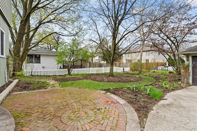 view of yard featuring fence and a patio area