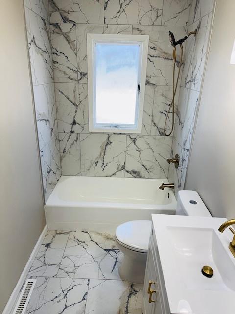 1507 7th St, Winthrop Harbor, IL 60096 - full bathroom featuring vanity, shower / tub combination, and marble finish flooring
