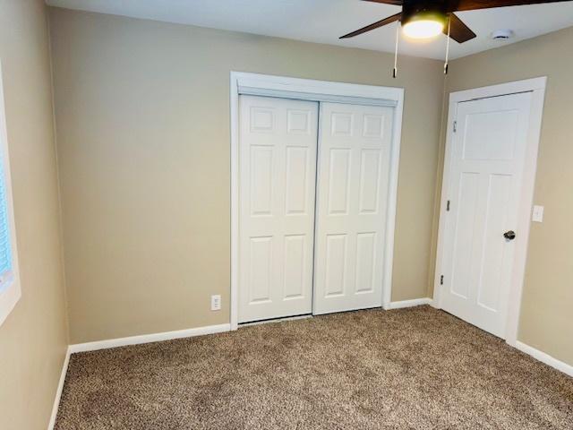 1507 7th St, Winthrop Harbor, IL 60096 - unfurnished bedroom with carpet flooring, a closet, and ceiling fan