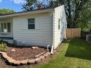 1507 7th St, Winthrop Harbor, IL 60096 - view of side of property with a chimney and a central AC unit