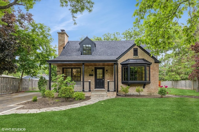 639 Harms Rd, Glenview, IL 60025 - view of front of home with a chimney, a porch, brick siding, and a shingled roof