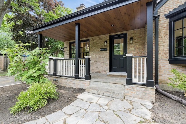 639 Harms Rd, Glenview, IL 60025 - doorway to property featuring a porch and brick siding
