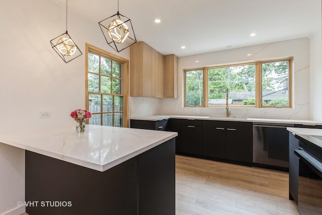 639 Harms Rd, Glenview, IL 60025 - kitchen with stainless steel dishwasher, dark cabinetry, a sink, light wood-type flooring, and decorative light fixtures