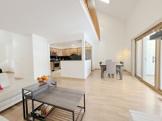 living room featuring recessed lighting and light wood finished floors