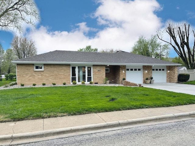 1299 Riverlane Dr, Bradley, IL 60915 - ranch-style house with driveway, an attached garage, a front lawn, and brick siding