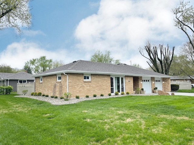 1299 Riverlane Dr, Bradley, IL 60915 - view of front of property featuring brick siding, a front lawn, fence, and an attached garage