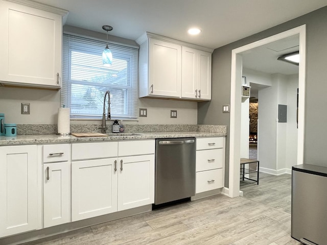 1299 Riverlane Dr, Bradley, IL 60915 - kitchen with white cabinets, a sink, appliances with stainless steel finishes, and light wood-type flooring