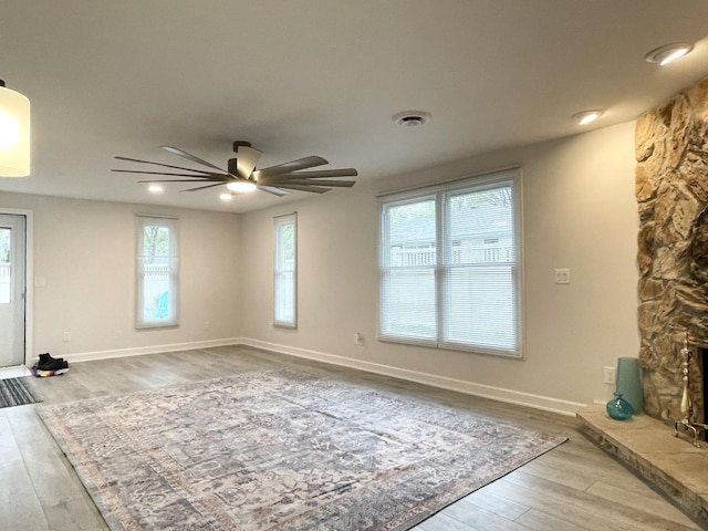 1299 Riverlane Dr, Bradley, IL 60915 - unfurnished living room featuring baseboards, ceiling fan, visible vents, and wood finished floors