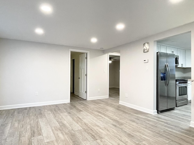 1299 Riverlane Dr, Bradley, IL 60915 - unfurnished living room with baseboards, light wood-style floors, and recessed lighting