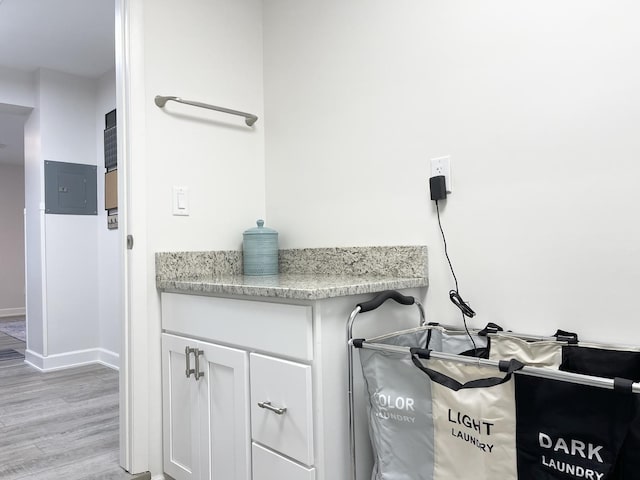 1299 Riverlane Dr, Bradley, IL 60915 - bathroom featuring baseboards, wood finished floors, and electric panel