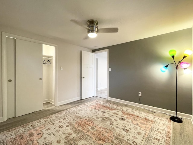 1299 Riverlane Dr, Bradley, IL 60915 - unfurnished bedroom featuring baseboards, wood finished floors, and a ceiling fan