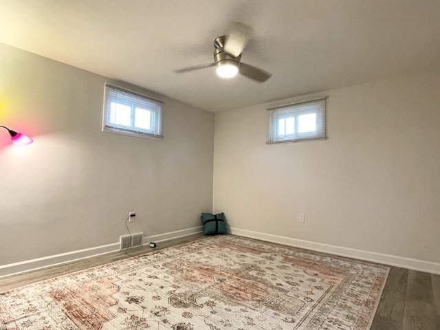 1299 Riverlane Dr, Bradley, IL 60915 - basement featuring visible vents, a healthy amount of sunlight, a ceiling fan, and wood finished floors