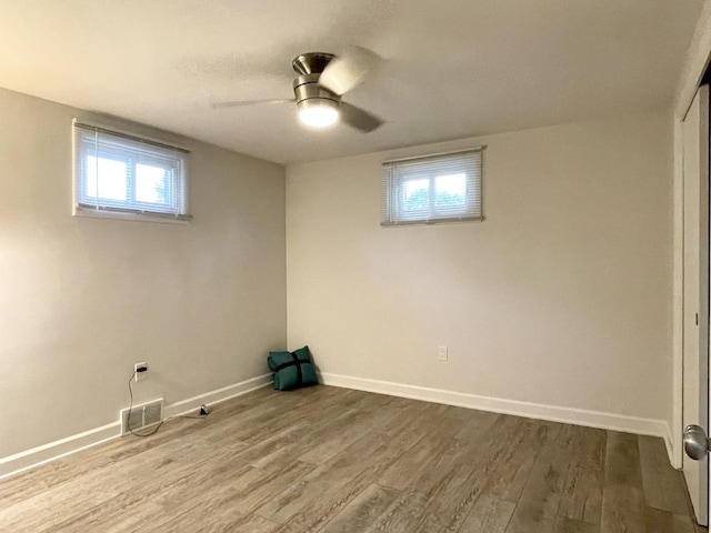 1299 Riverlane Dr, Bradley, IL 60915 - below grade area featuring dark wood-type flooring, baseboards, and visible vents