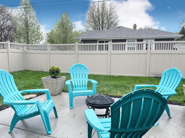 1299 Riverlane Dr, Bradley, IL 60915 - view of patio featuring a fenced backyard and a fire pit