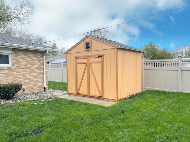 1299 Riverlane Dr, Bradley, IL 60915 - view of shed featuring a fenced backyard