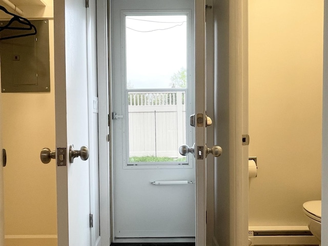 1299 Riverlane Dr, Bradley, IL 60915 - doorway to outside featuring a baseboard heating unit and electric panel
