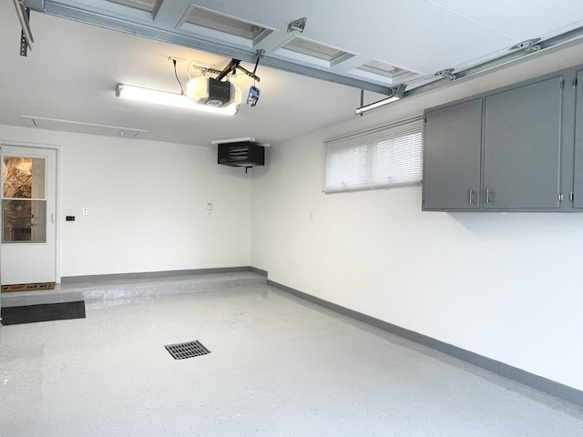 1299 Riverlane Dr, Bradley, IL 60915 - garage with baseboards and a garage door opener