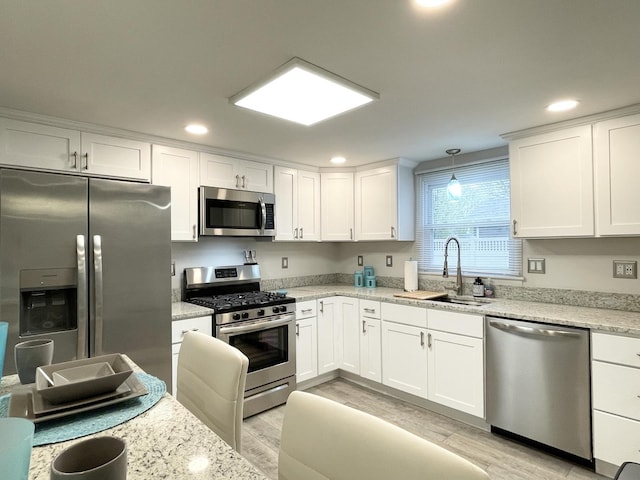 1299 Riverlane Dr, Bradley, IL 60915 - kitchen featuring white cabinets, a sink, and stainless steel appliances