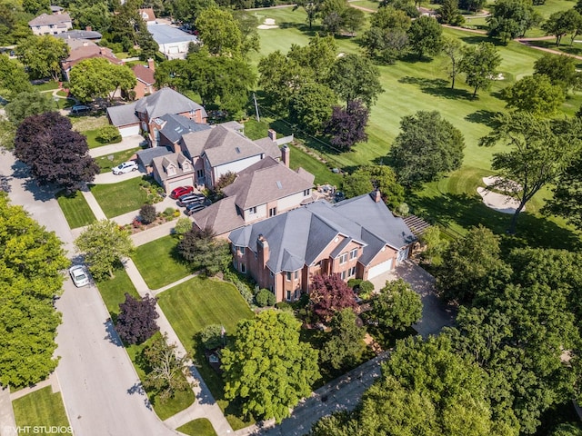 bird's eye view with view of golf course and a residential view
