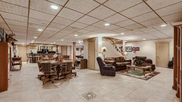 living area with recessed lighting and a paneled ceiling