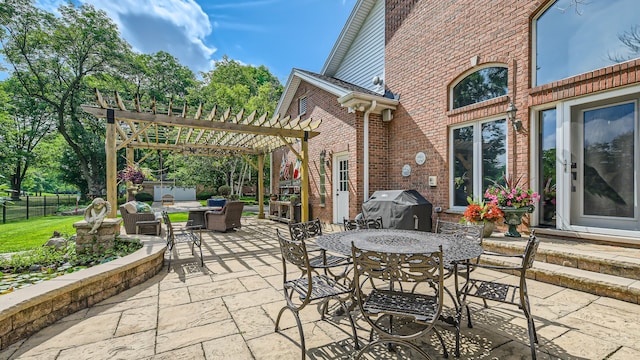 view of patio / terrace with outdoor dining space, fence, a pergola, and grilling area