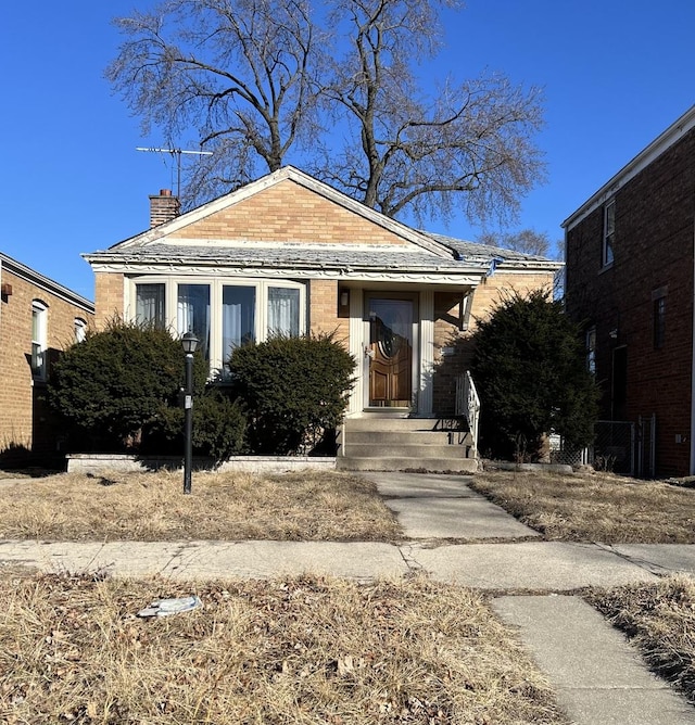 9731 S Ellis Ave, Chicago, IL 60628 - bungalow-style home featuring a chimney