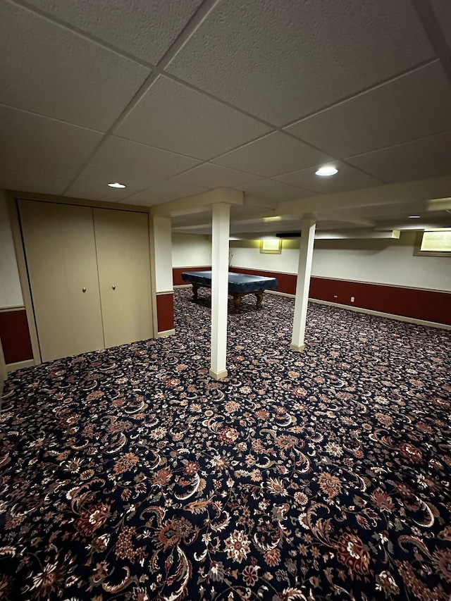 finished basement with pool table, recessed lighting, and a paneled ceiling
