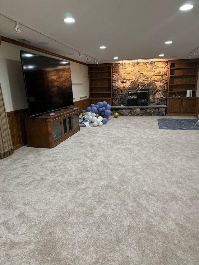 living room with track lighting, carpet flooring, wainscoting, and recessed lighting
