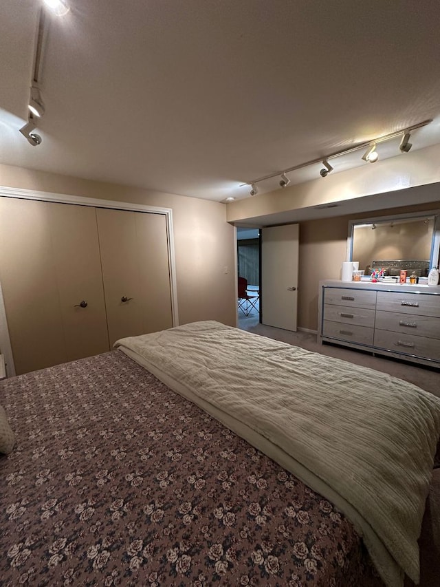 bedroom featuring track lighting
