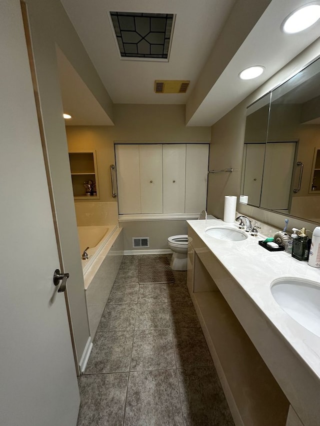 full bathroom with toilet, visible vents, a sink, and a bath