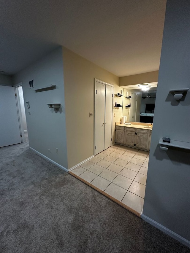 bathroom with baseboards, visible vents, and vanity
