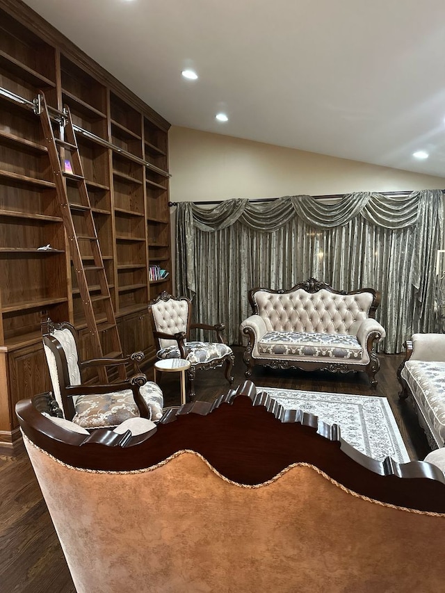 living area with recessed lighting, lofted ceiling, and dark wood-style floors