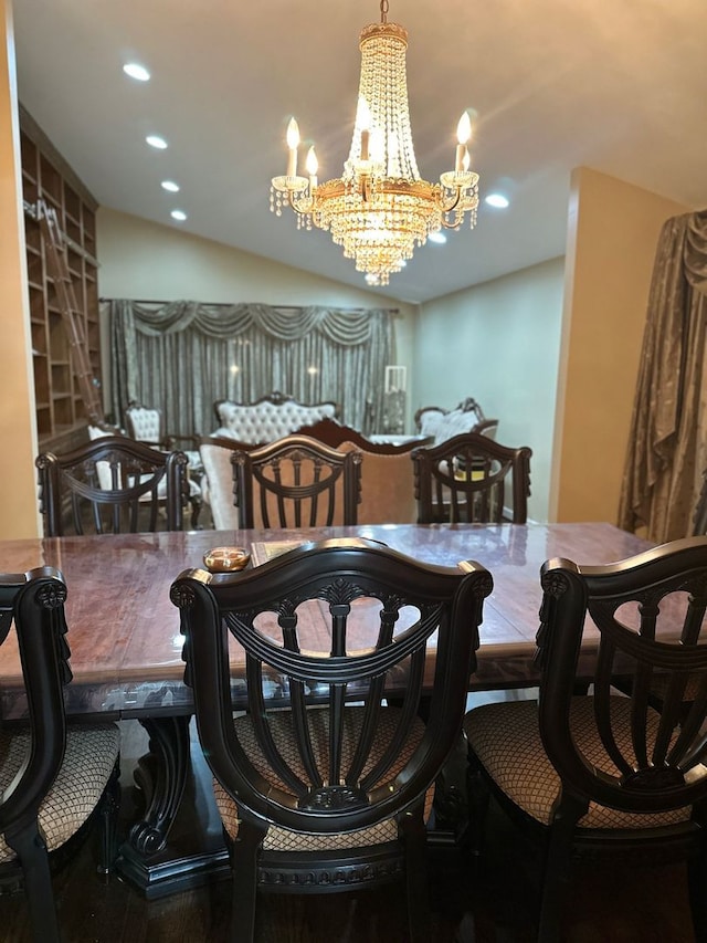 dining area featuring recessed lighting, wood finished floors, and a notable chandelier