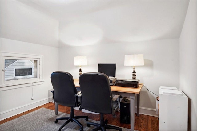 home office featuring baseboards and wood finished floors